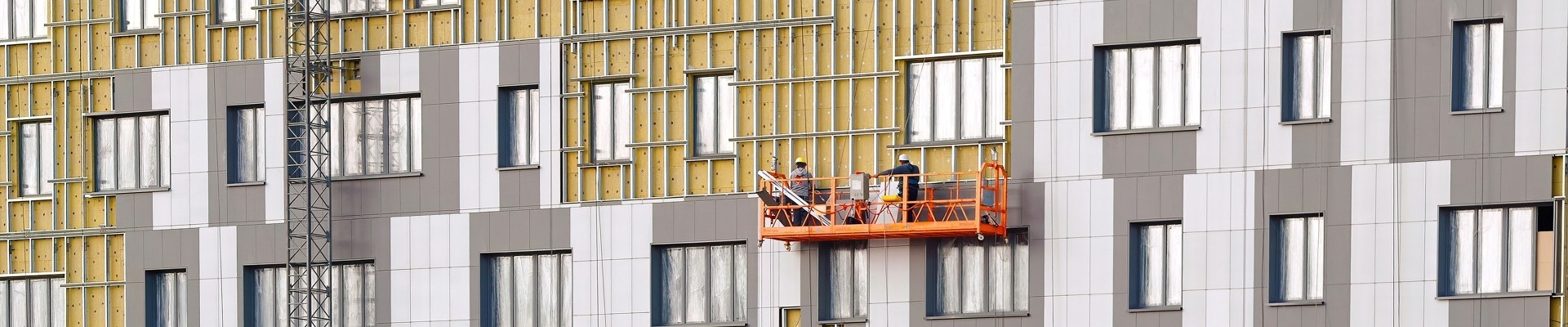 Workers team on construction cradle