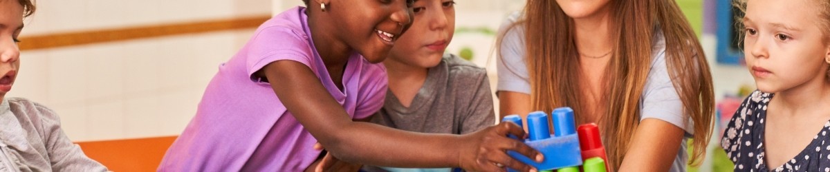 Children play together with building blocks in the international kindergarten