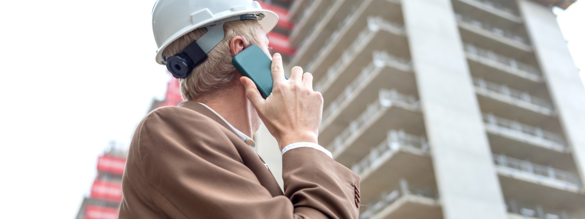 Builing safety and remediation   worker on phone