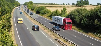 A14 dual carriageway with trees and traffic