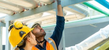 Two people in PPE assessing a building   resized