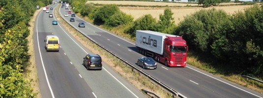 A14 dual carriageway with trees and traffic