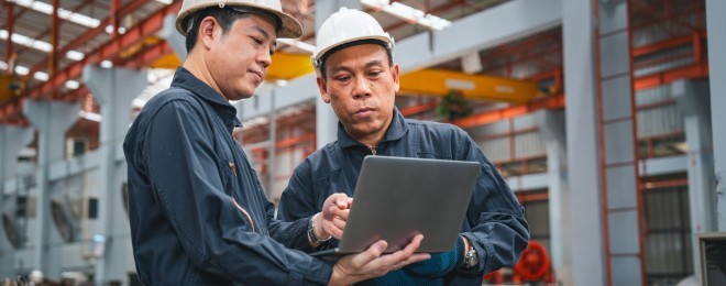 Builing safety and remediation   workers comparing notes