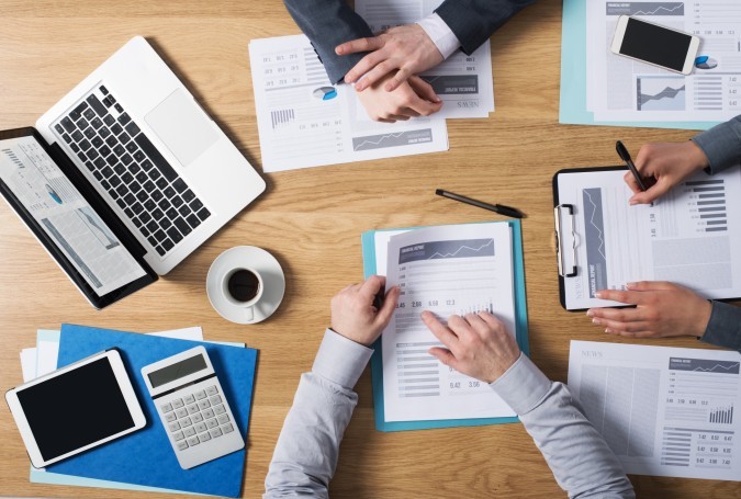 Business people team working together at office desk