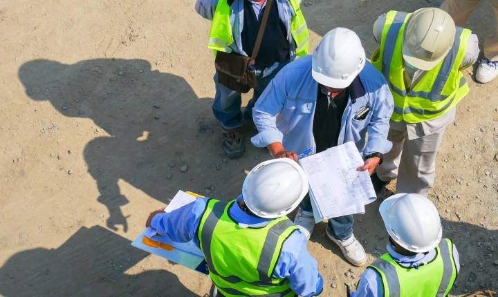 Aerial view group of construction worker meeting at construction site