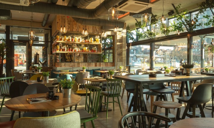 Interior of a modern urban restaurant in the morning sunlight