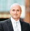 Mike Coogan Associate Director
