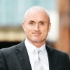 Mike Coogan Associate Director