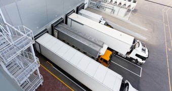 Big distribution warehouse with gates for loads and trucks