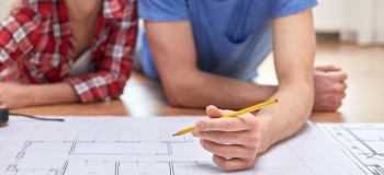 Two people editing a blueprint