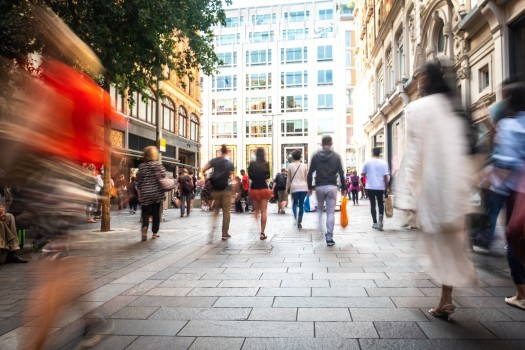 Motion blurred crowds of shoppers on busy London street