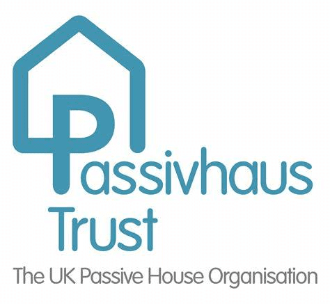 A teal logo of a simplified house incorporating the letter P, which then goes on to spell "Passivhaus Trust". The text underneath states "the UK Passive House Organisation"